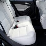 Explore the modern and luxurious feel of a car's interior with pristine white leather seats.